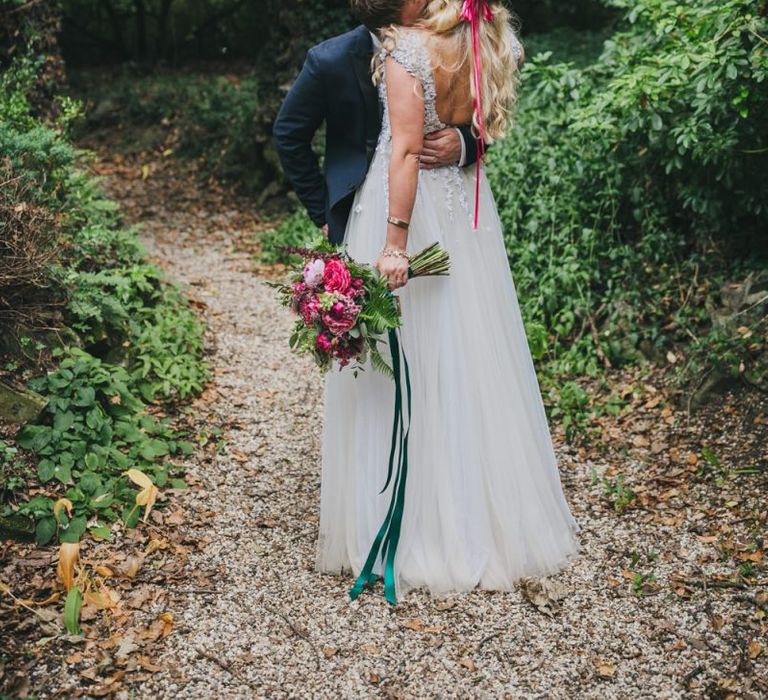 Bride carried pink bouquet wearing pink flower crown