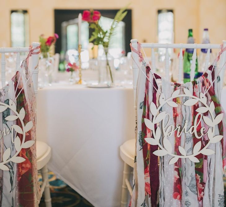 Wedding chair decor with tassels at conservatory wedding venue