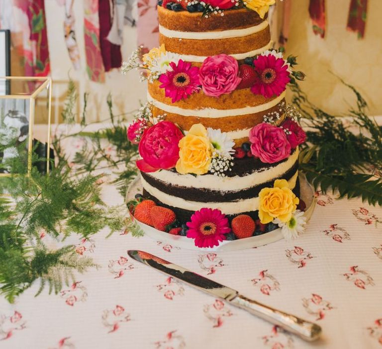 Naked wedding cake with flower decor