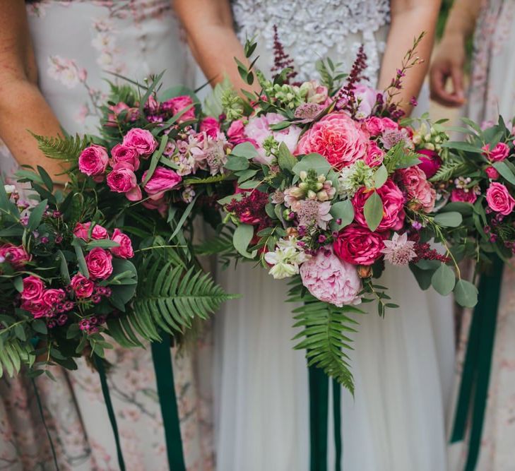 Bright pink wedding bouquets for bridesmaids