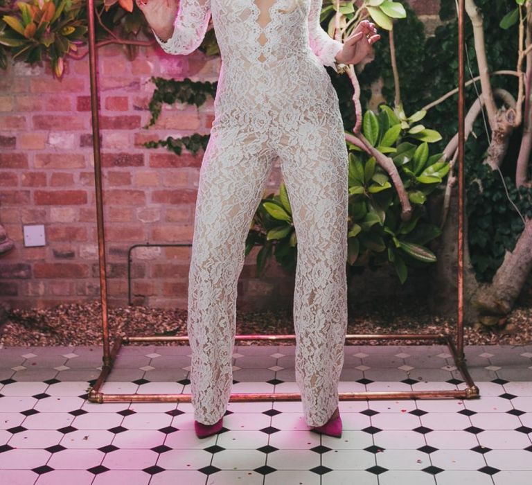 Bridal jumpsuit with neon wedding sign