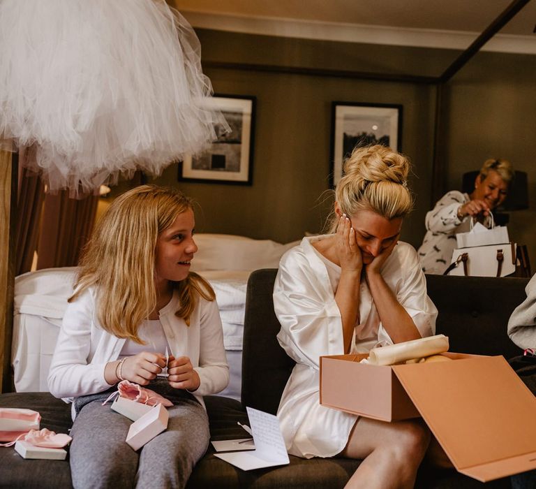 Bride Opening a Gift Box From Her Groom on The Wedding Morning