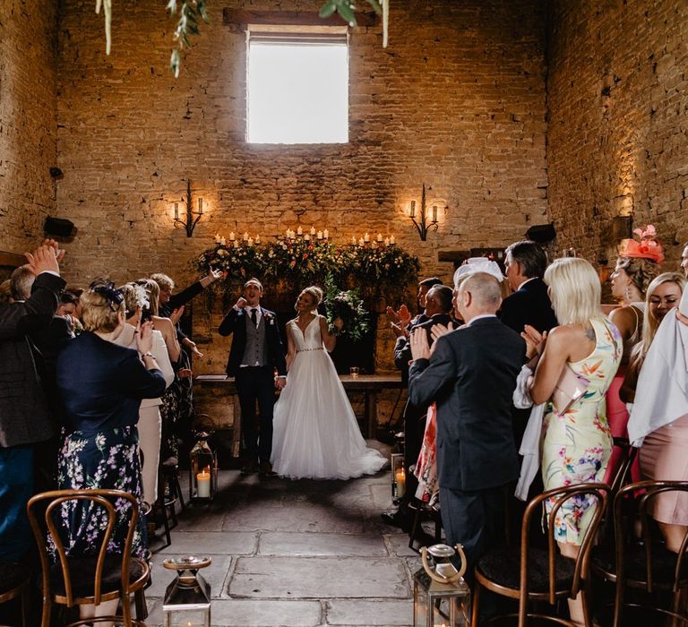 Bride and Groom Celebrating Being Just Married at Cripps Barn Wedding Venue