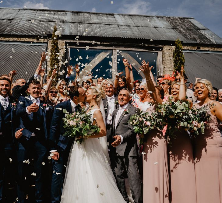 Confetti Moment Outside Cripps Barn with Wedding Party in Navy and Pink Outfits