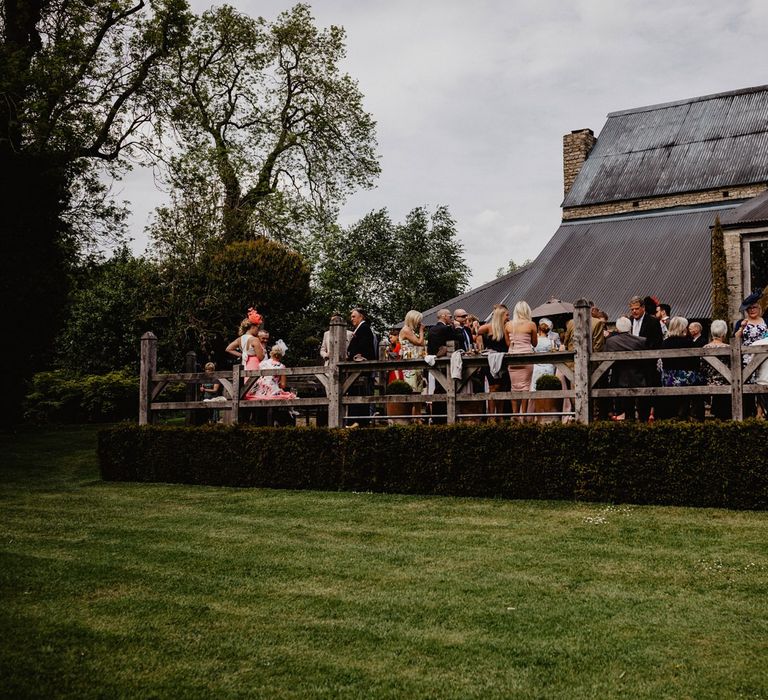 Wedding Guests Enjoying the Drinks Reception on Cripps Barns Veranda