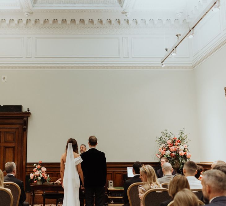 Bride and groom tie the knot at an informal party celebration in Liverpool