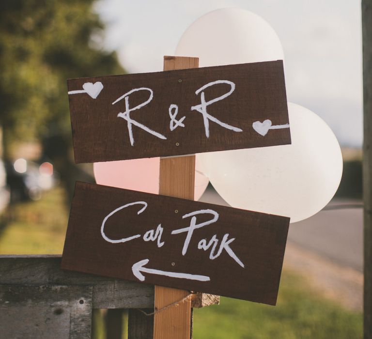 Wooden wedding signs at rustic barn