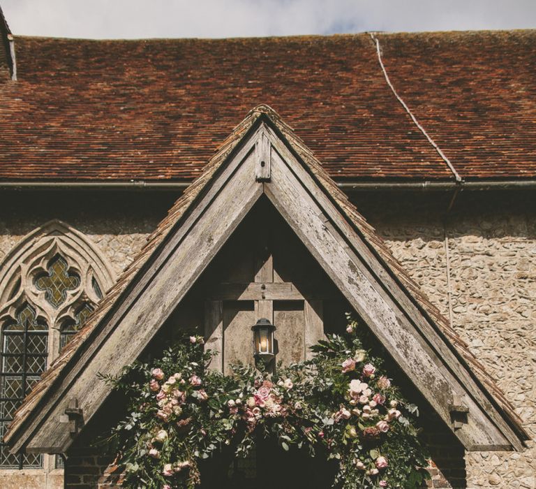 Wedding flowers at church ceremony entrance