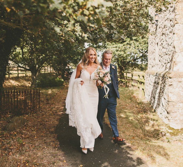 Bride making her way to wedding ceremony