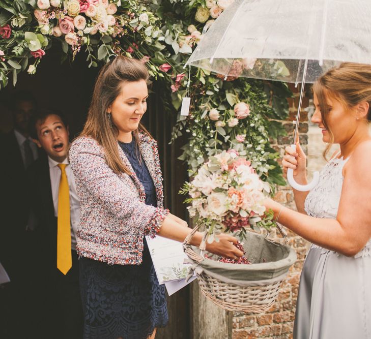 Pale blue bridesmaid dresses and confetti basket