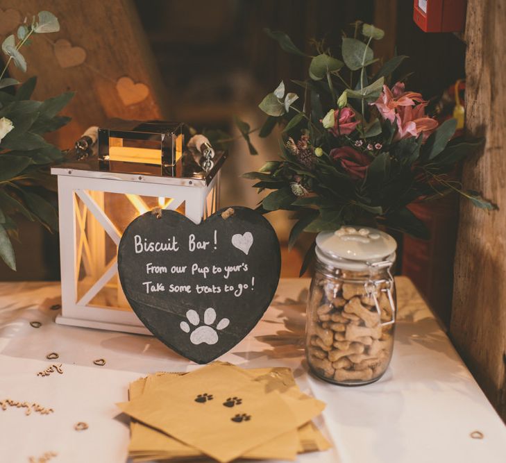 Dog biscuit wedding favours at celebration with pale blue bridesmaid dresses