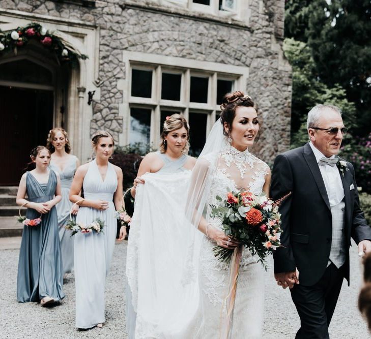 Grey Bridesmaid Dresses with Bright Bouquet at Outdoor Wedding