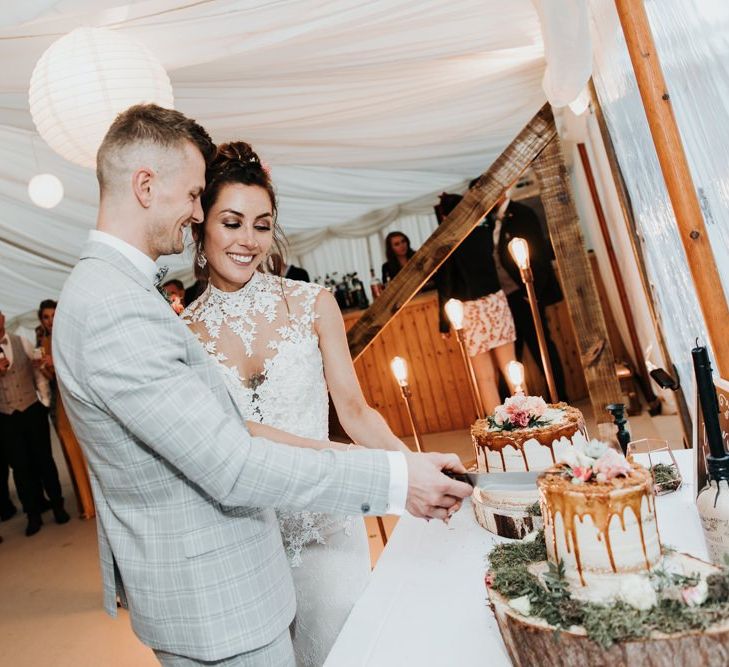 Cutting Rustic Drip Wedding Cake