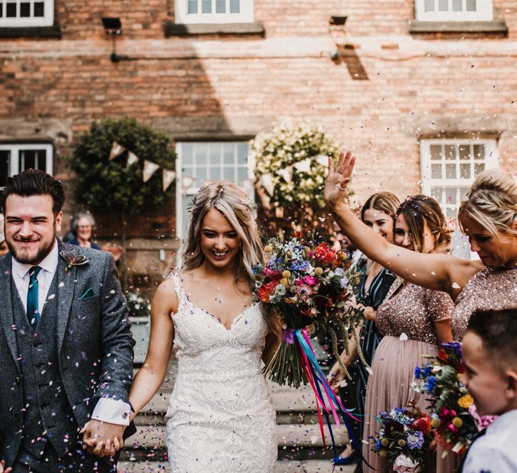 Rainbow Tassel Bunting Wedding At Industrial Venue The West Mill Derby With Bridesmaids In Maya Sequin And Tulle Dresses // Images By Carla Blain Photography