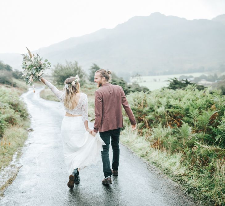 Bride and Groom Dancing Down a Country Lane