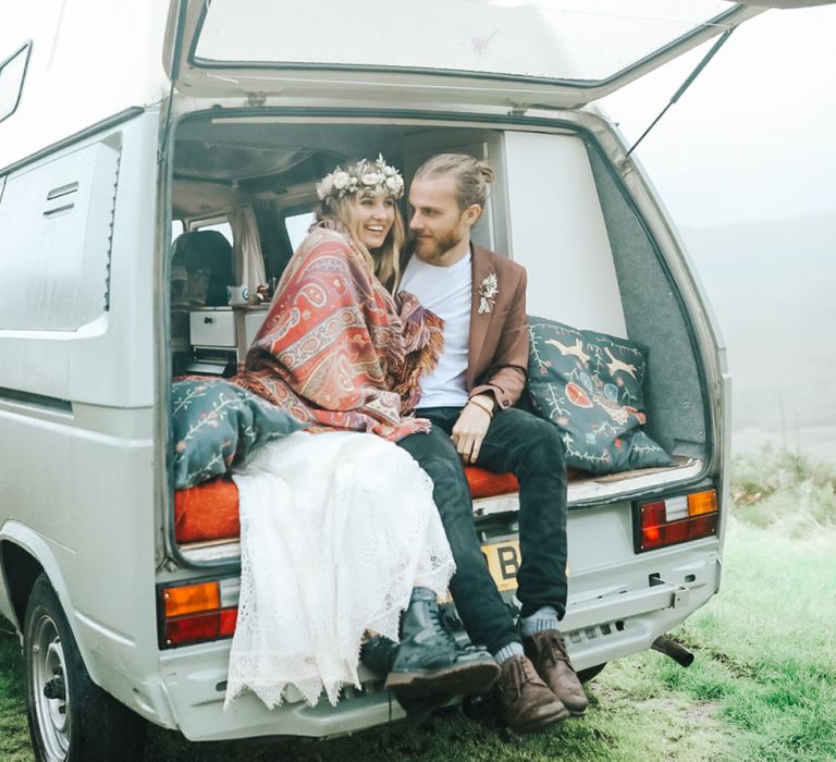 Boho Bride and Groom Snuggled in the Back of a Camper Van