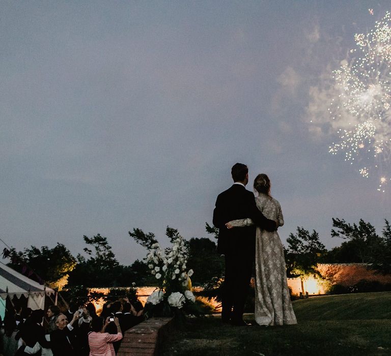 Bride and Groom Watch Fireworks During Evening Reception