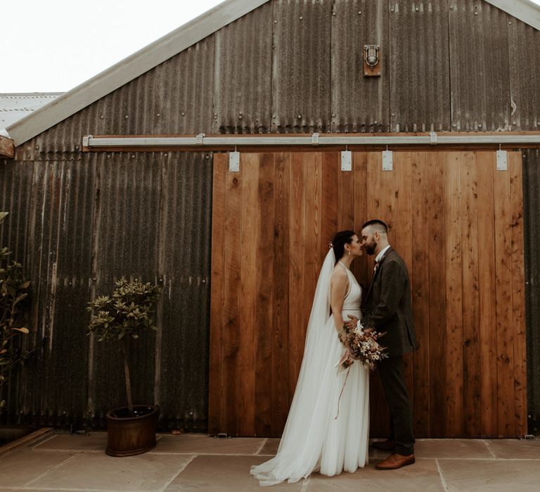 Bride and groom portrait at their 1st August 2020 wedding at  Eden Barn