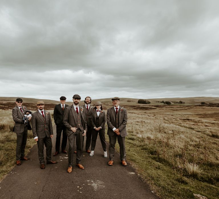 Groomsmen in wool suits and flat caps in the Lake District for Eden Barn wedding