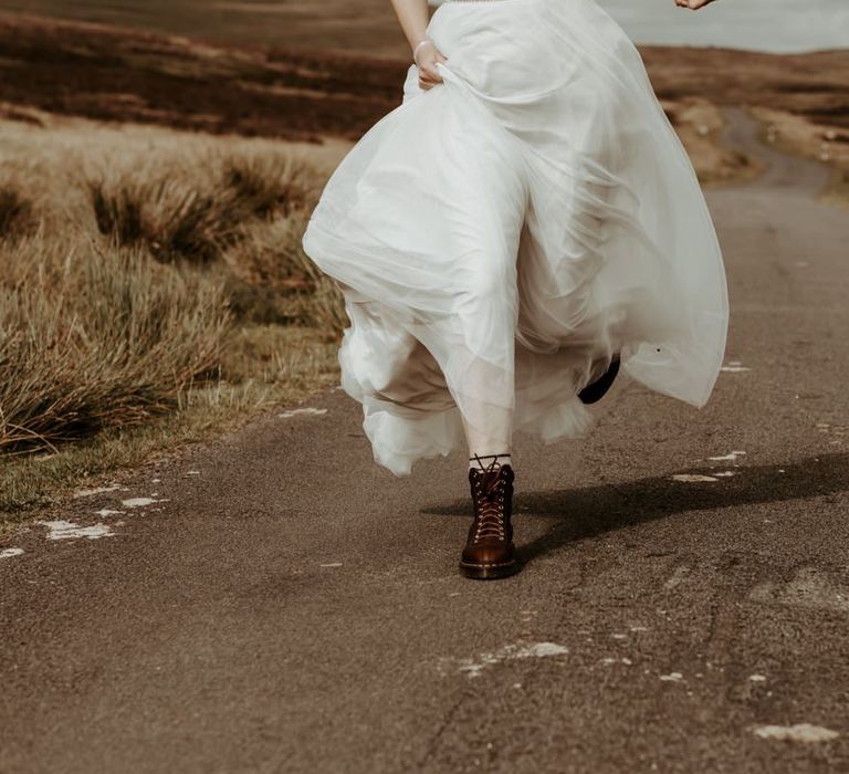 Bride in brown Dr Marten boots for Eden Barn, Lake District  wedding