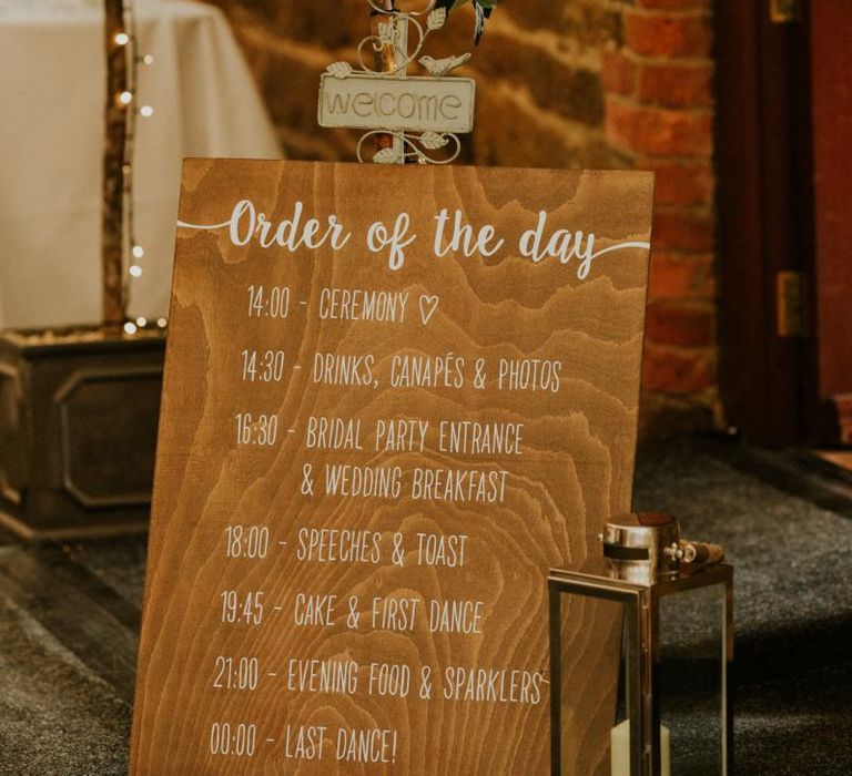 Wooden wedding signs at marquee wedding