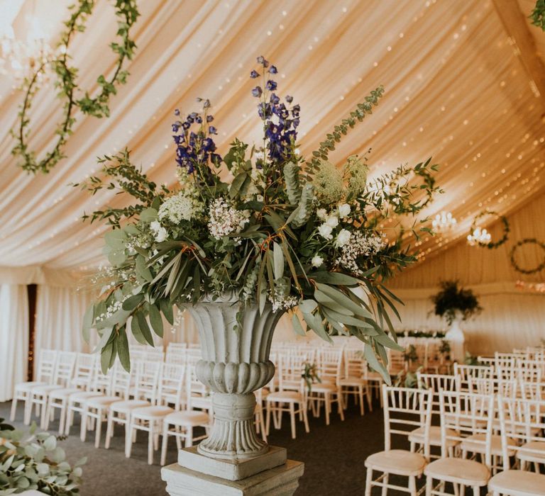 Hoop wedding decor at marquee ceremony with wooden wedding signs