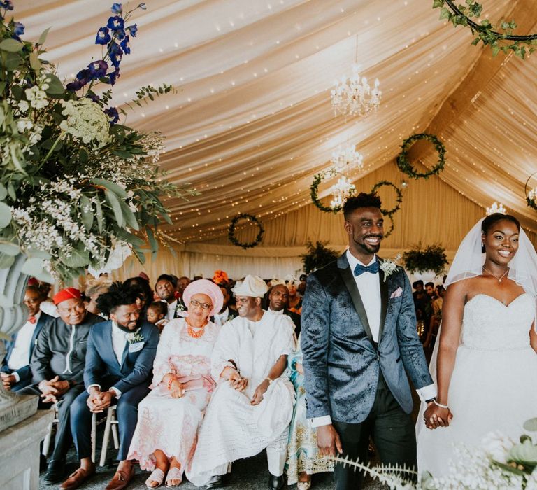 Bride and groom during ceremony with hoop decor