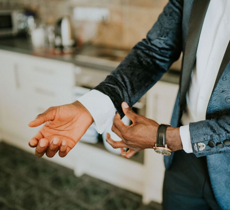 Groom preparations at Northamptonshire wedding venue with blue patterned dinner jacket