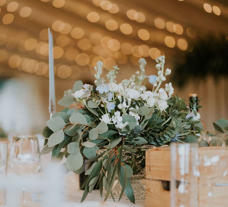 Foliage wedding decor with wooden wedding signs and hoop decoration