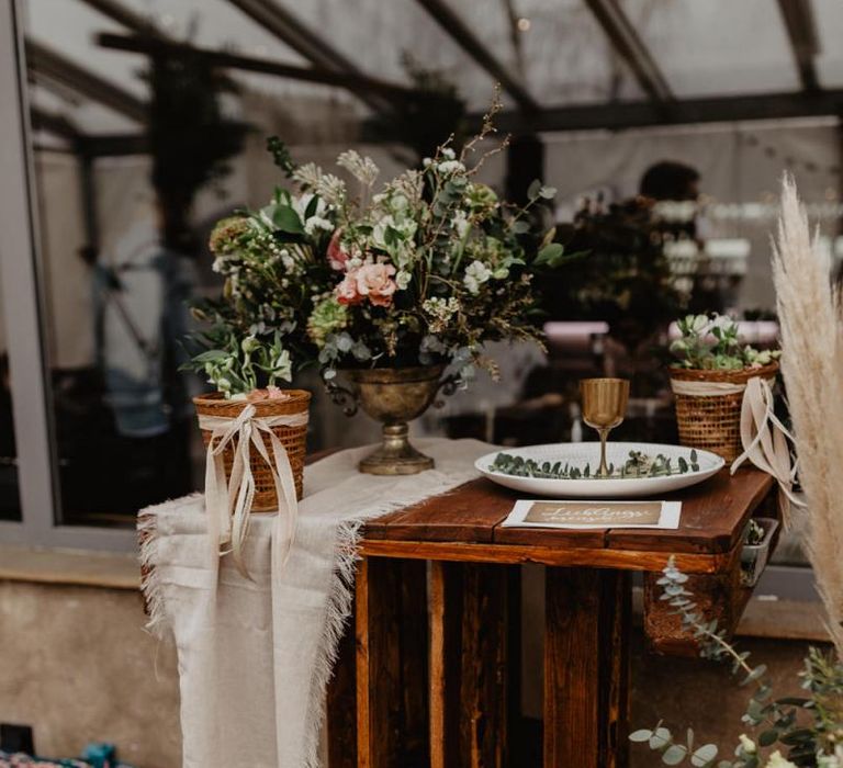 Boho wedding decor with pink flowers