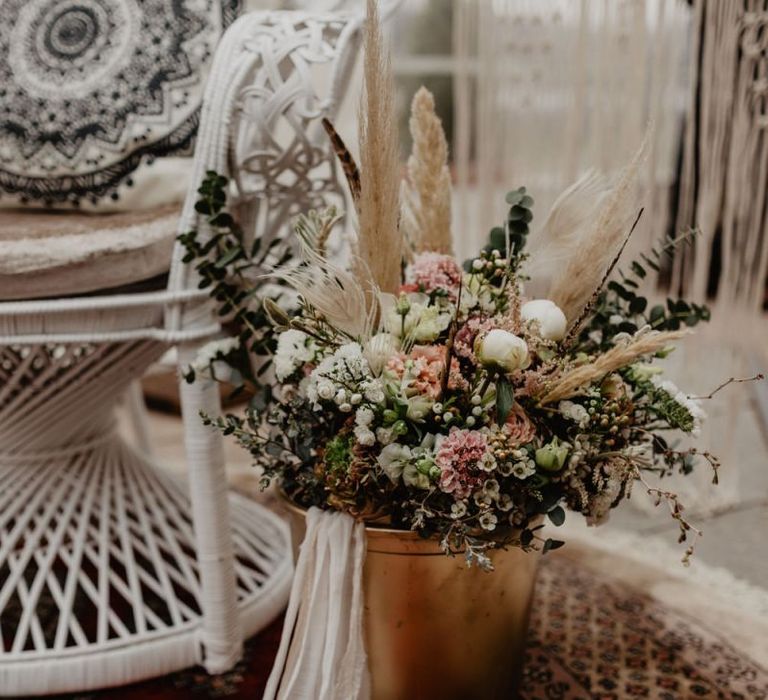 Boho wedding decor with pink flowers