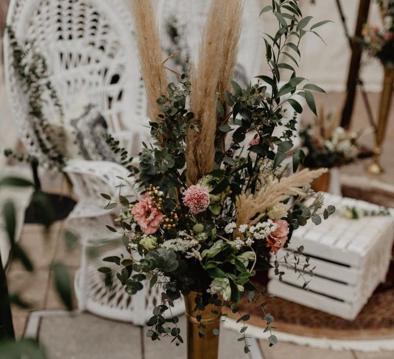 Boho wedding decor with pink wedding flowers