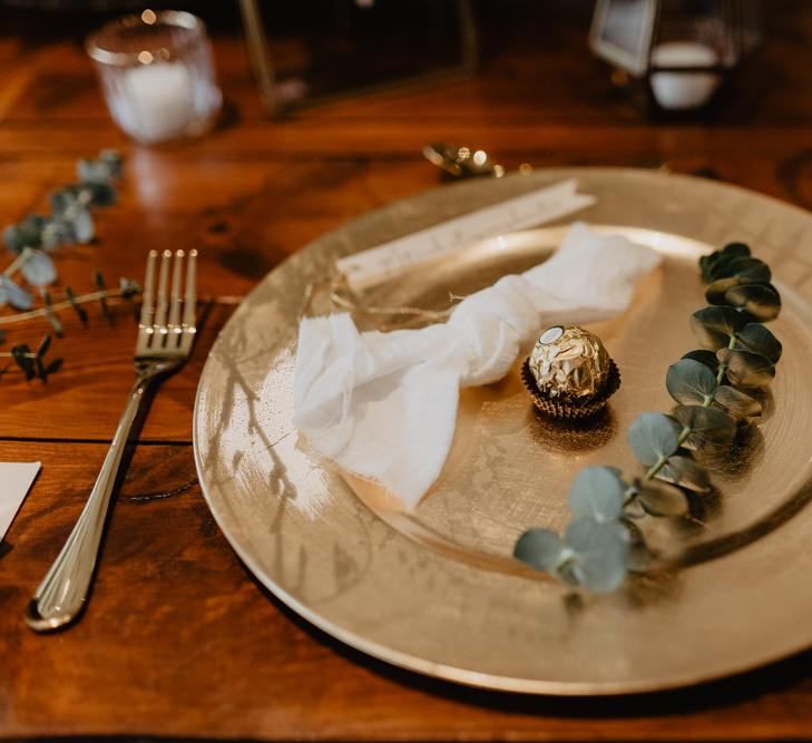 Gold place setting at boho inspired wedding