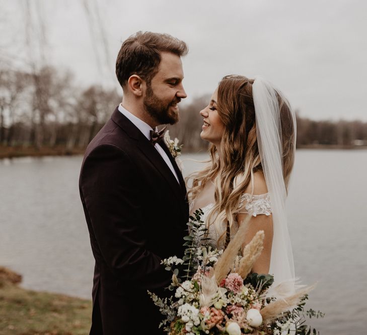 Groom in brown wedding suit for boho wedding