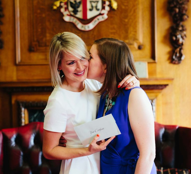 Brides kissing at Lesbian wedding