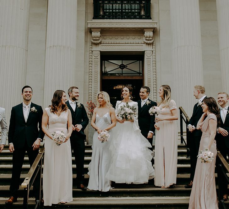 Wedding party portrait on step at registry office wedding