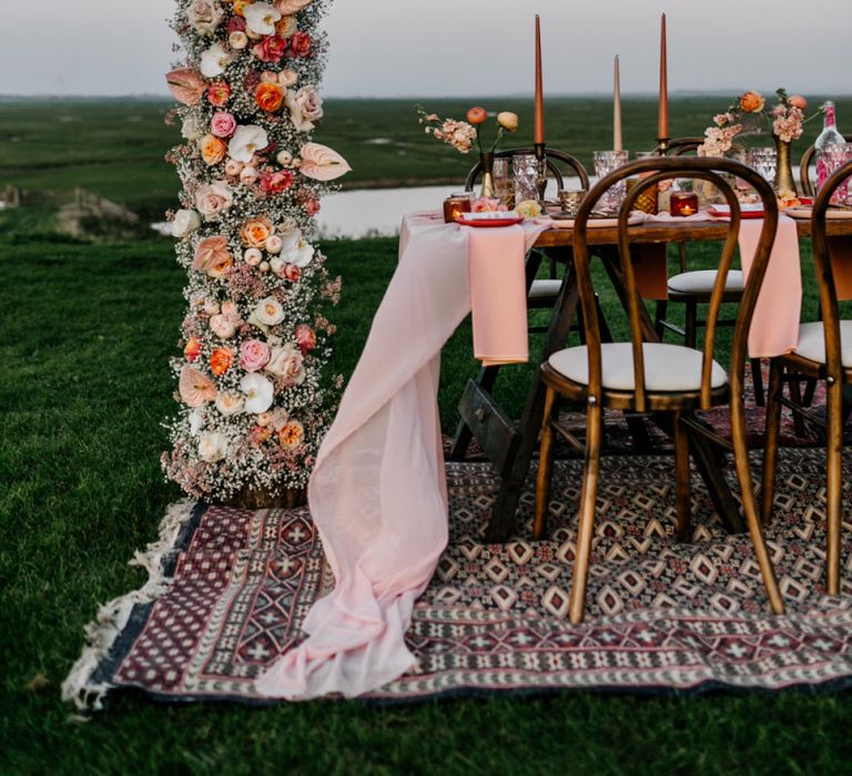 Outdoor Tablescape on Rug with Flower Column