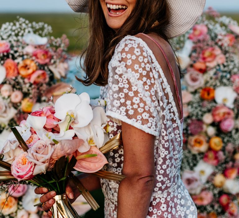 Happy Bohemian Bride in Lace Wedding Dress and Floppy Hat