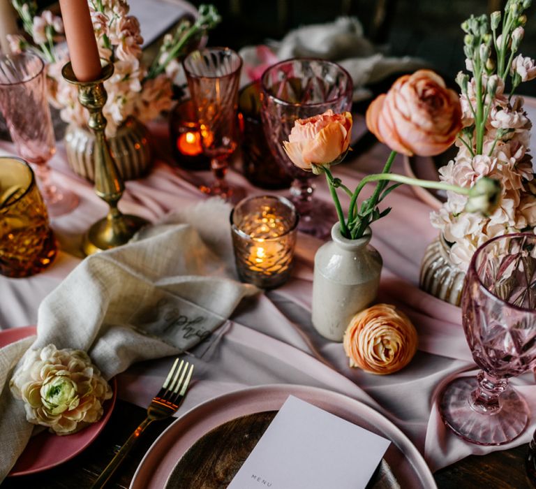 Place Setting with Blush Pink Crockery and Ink Wells Filled with Ranunculus Flower Stems