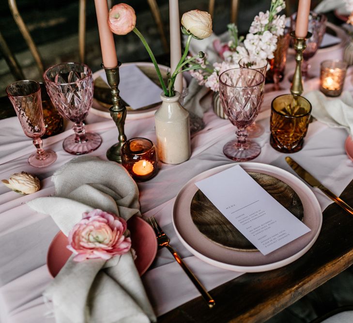 Elegant Place Setting with Pink Charger Plate and Glass Goblets