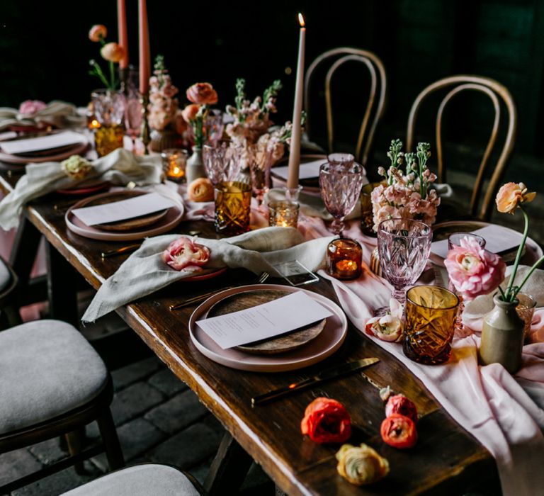 Colourful Tableware and Glass with Taper Candles, Flowers and Linens