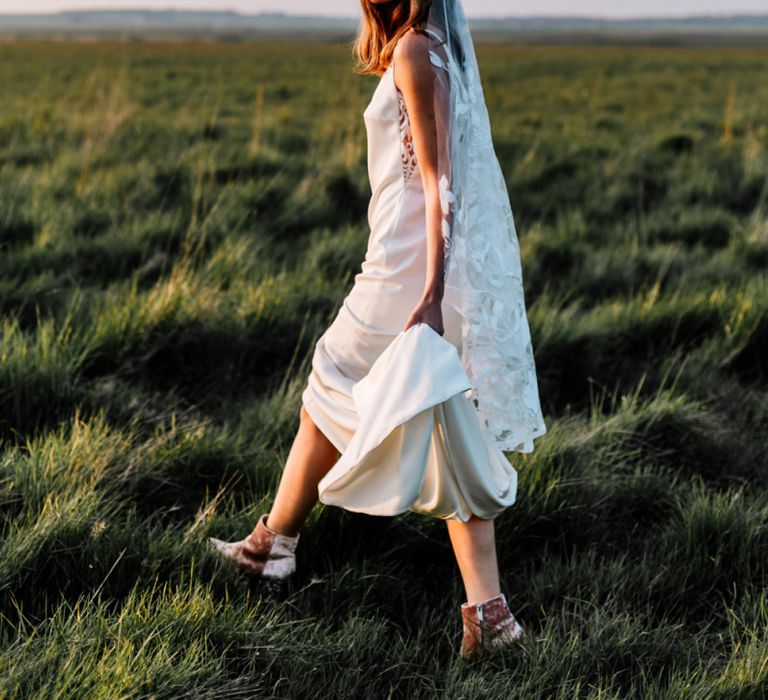 Boho Bride in Slip Wedding Dress, Lace Veil and Pink Suede Boots