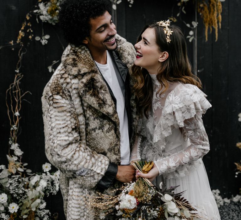 Beautiful Bride in Gold Crown and Red Lipstick with Groom with Afro Hair