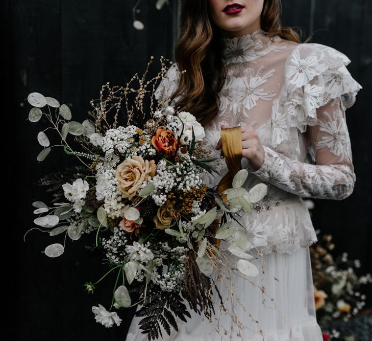 Bride in Lace High Neck Wedding Dress Holding a Dried Flower Wedding Bouquet