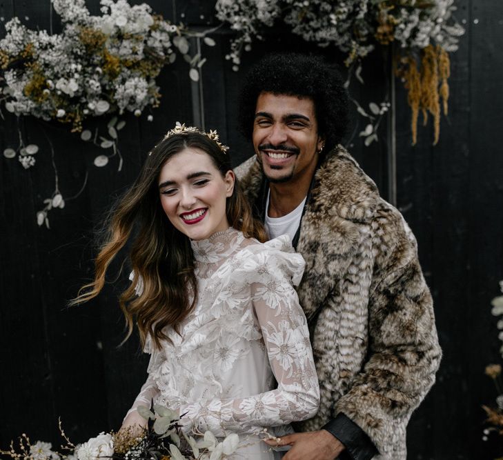 Modern Bride and Groom Laughing at their dried flower altar