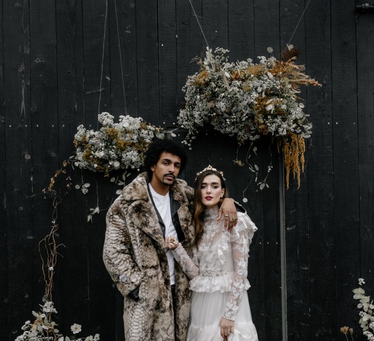 Bride in Tired Lace Wedding Dress and Snakeskin Bridal Boots