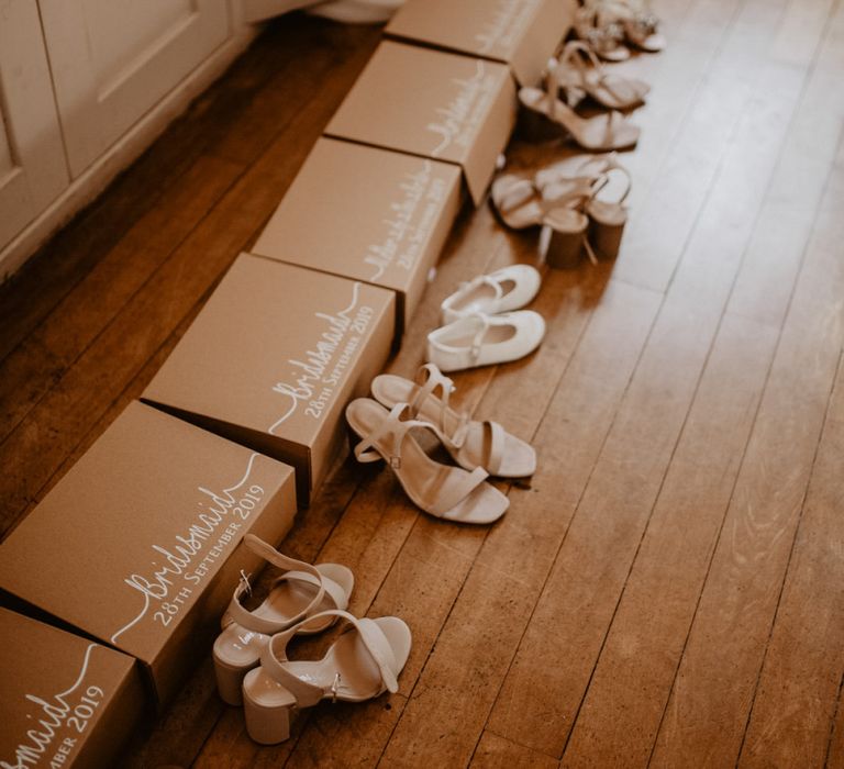 Bridesmaid gift boxes and shoes on wedding morning