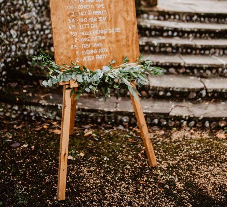 Wooden welcome and order of the day sign on an easel