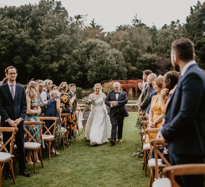 Outdoor wedding ceremony bridal entrance at Voewood in Norfolk