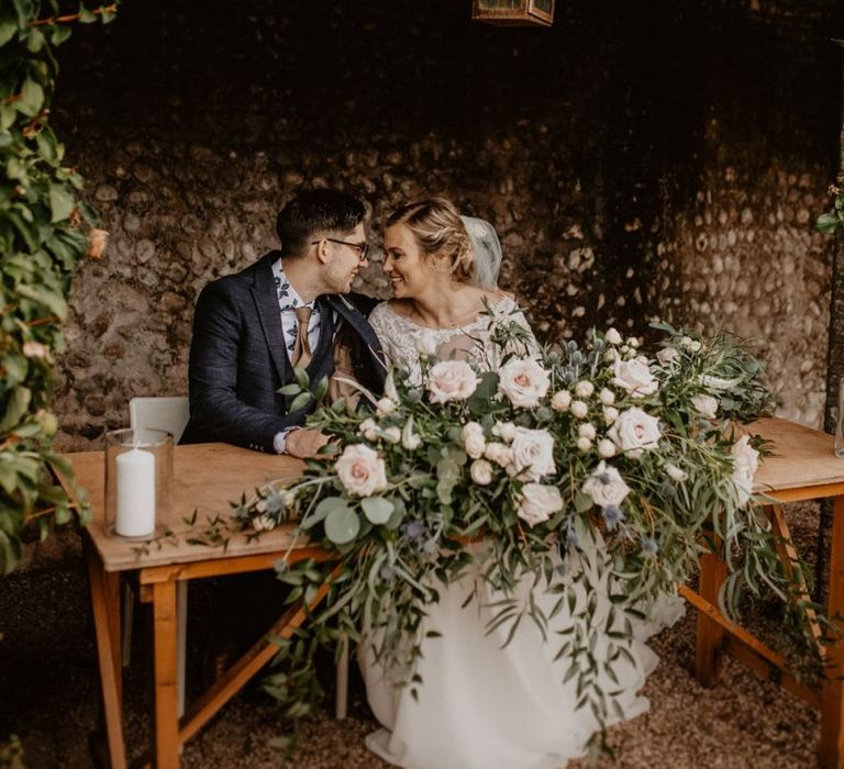 Bride and groom signing the register at Voewood wedding ceremony